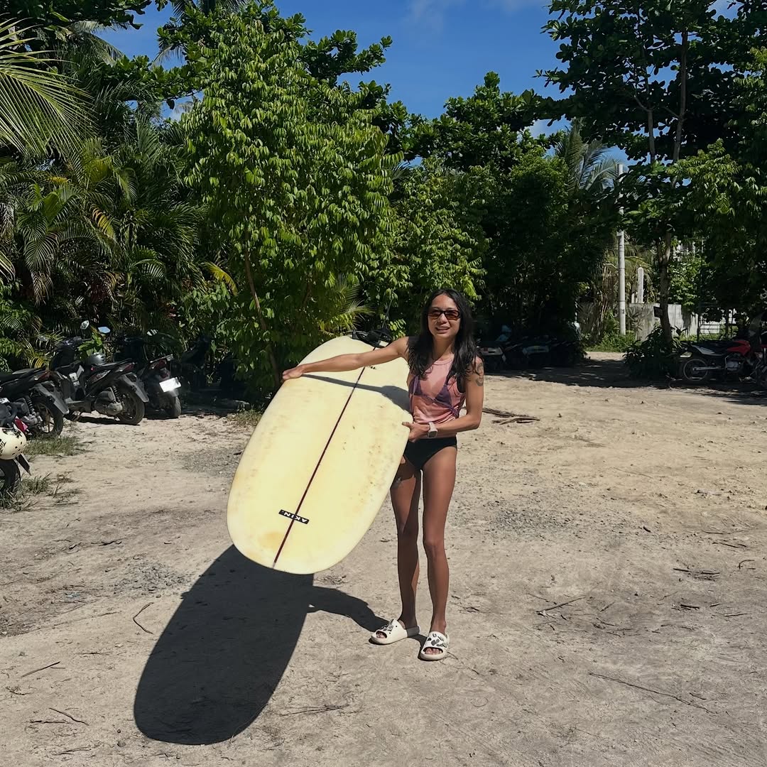 Surfer with board on the beach